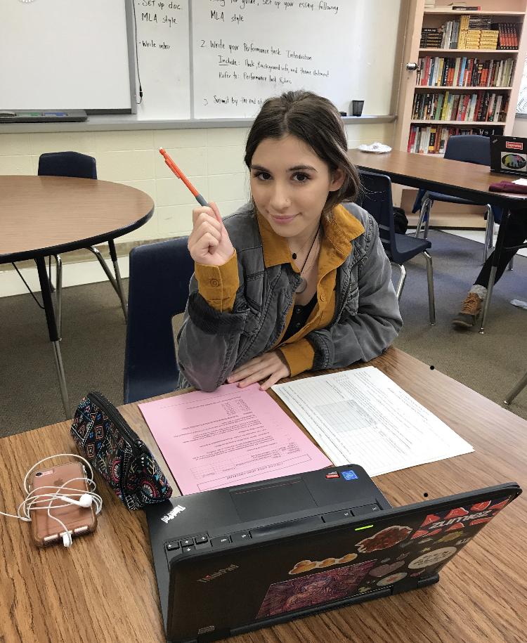 Angélica Rivera-Oliveira is looking over the college checklist that she picked up from school counseling