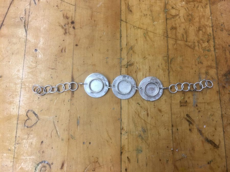A bracelet almost fully assembled by a student in independent study.