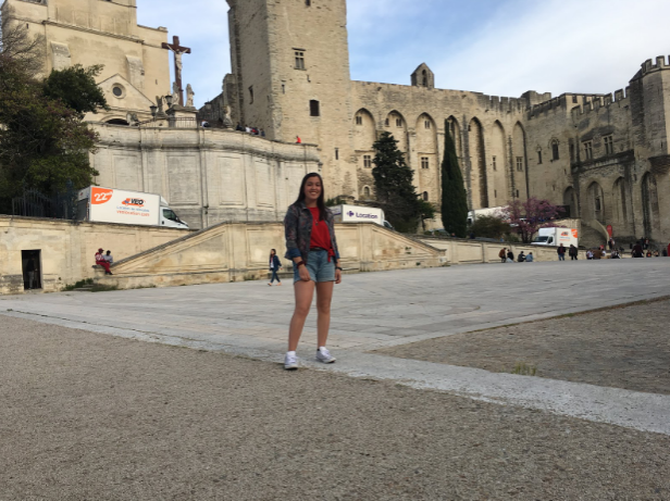 Sydney Fournier, Junior, standing in front of the Palais des Papes in Avignon, France.