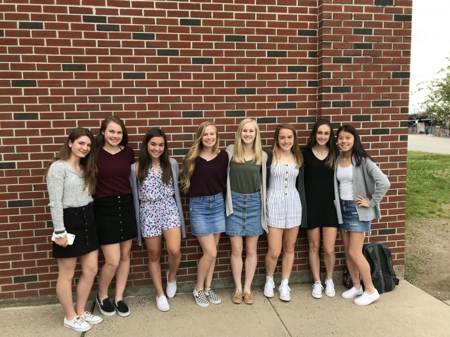 Just before changing into their uniforms, athletes (from left to right) Abby Grohs, Erin Dunn, Candace Walsh, Cora Brownbill, Jess Polito, Anna Armstrong, Rhianna Omeara, and Emma Metevier posed for a picture. 