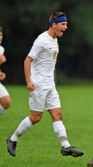  Senior Varsity soccer player Owen Cotton displays his excitement on the field after scoring.