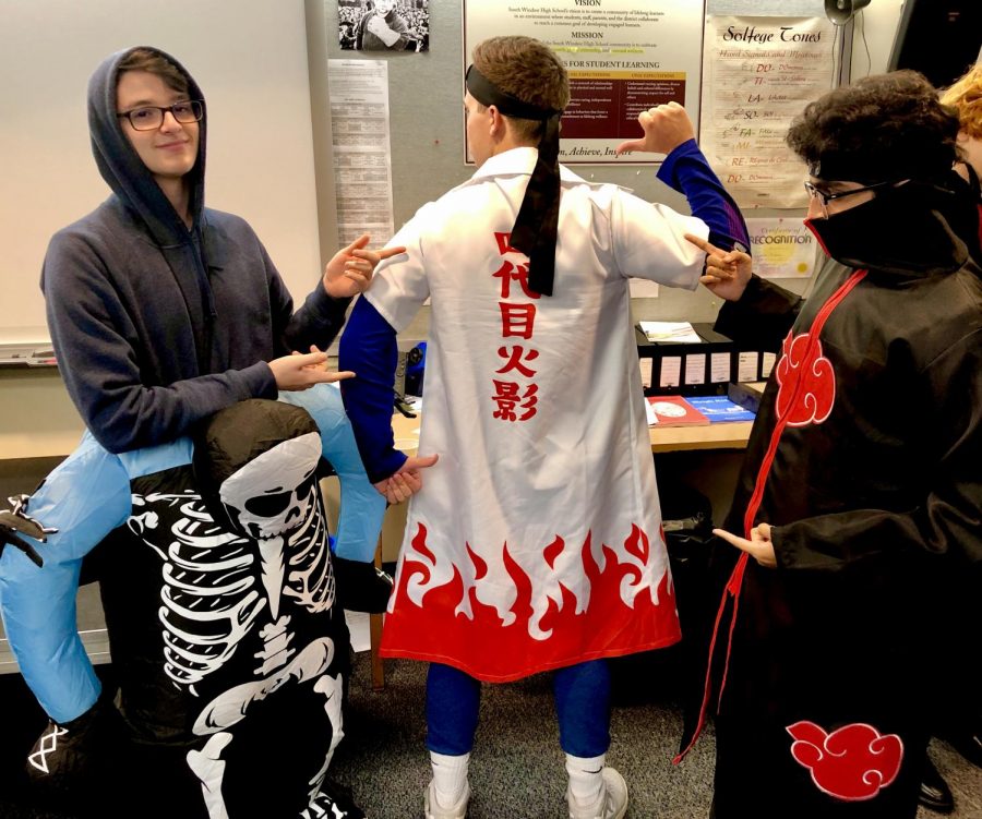 Jake Silverman, left, Evan Rapp, middle, and Rohan, right, looking very excited for Halloween as they were fully dressed up for the day.