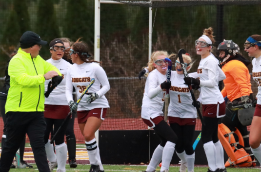 The girls cheered and embrace one another in excitement after Lindsey Osit scores the first goal for the Bobcats in the state tournament. 