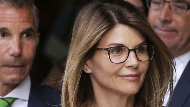 Lori Loughlin and husband, Mossimo Giannulli (left), are seen as they leave Boston Federal Court.
Source: Fox News