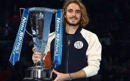 Stefanos Tsitsipas posing with his newly won ATP Trophy
Source: skysports.com