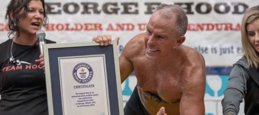  Hood held his certificate after successfully surpassing Mao Weidong’s record setting plank by 14 mins and 14 seconds.  

