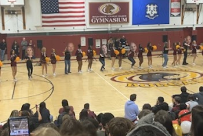 Cheerleaders performing for students attending the 2022 pep rally.  