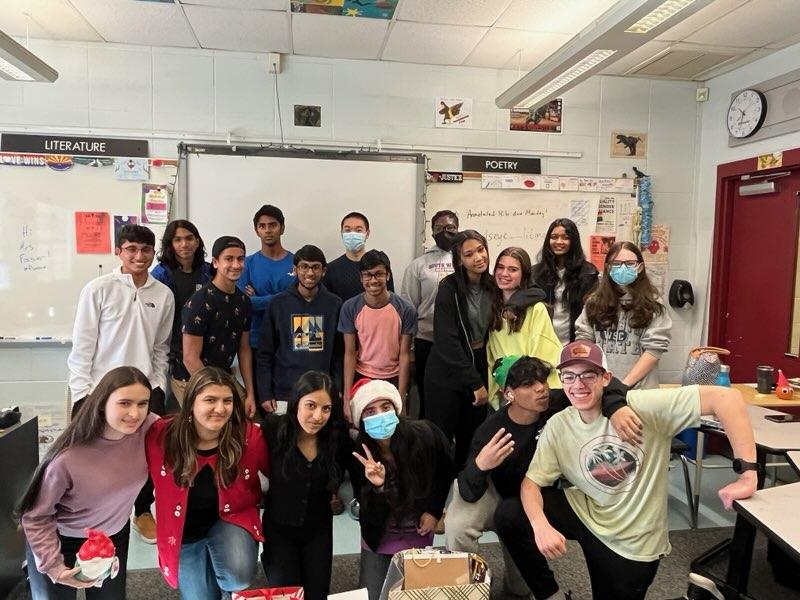 Mrs. Flachsbarts Period 6 AP Lang Class exchanging gifts and holiday cheer.