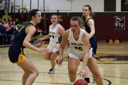 Junior center Katherine Dunn heads to the hoop as South Windsor girls basketball team takes on Rham on senior night. 
