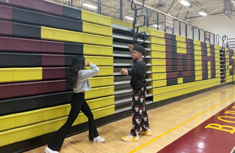 South Windsor High School students practice karate in the gym. 