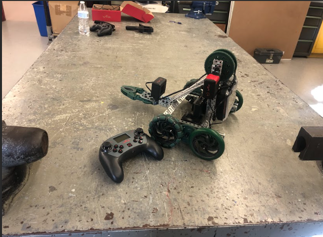 With the rise of AI, there are concerns about technology ultimately being the ones in control. Pictured- robot created by the South Windsor High School robotics team with its controller. 