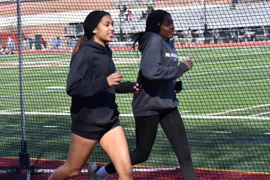 From left, senior Oliva Petgrave and Senior Chion Pollard (right) get ready for an upcoming outdoor track meet.