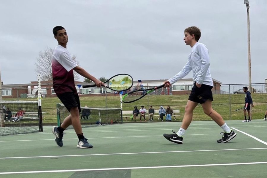 Sophomore Aayann Rehman and junior Noah Marques hitting racquets congratulating each other on South Windsor’s 5-2 win against Conard.