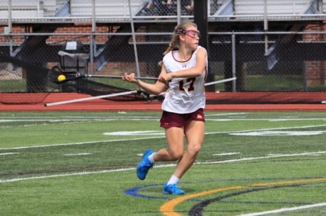 Sophomore Hailey Deptula winding up for a shot while playing against Conard on April 25th.