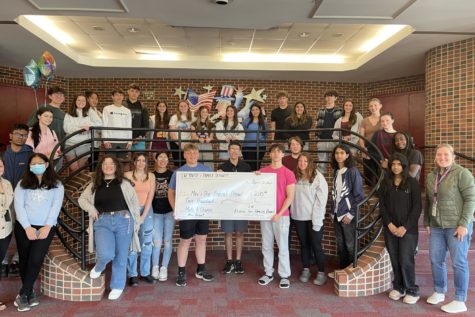 The Bobcat Prowl student newspaper staff poses with members of the S.W. Youth and Family Services and the S.W. Alliance for Families after being awarded a grant.