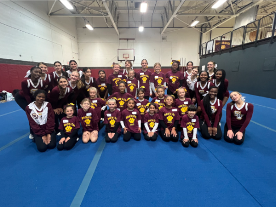 The South Windsor High School cheerleaders and the South Windsor Panthers cheerleaders together before the game on September 23rd.