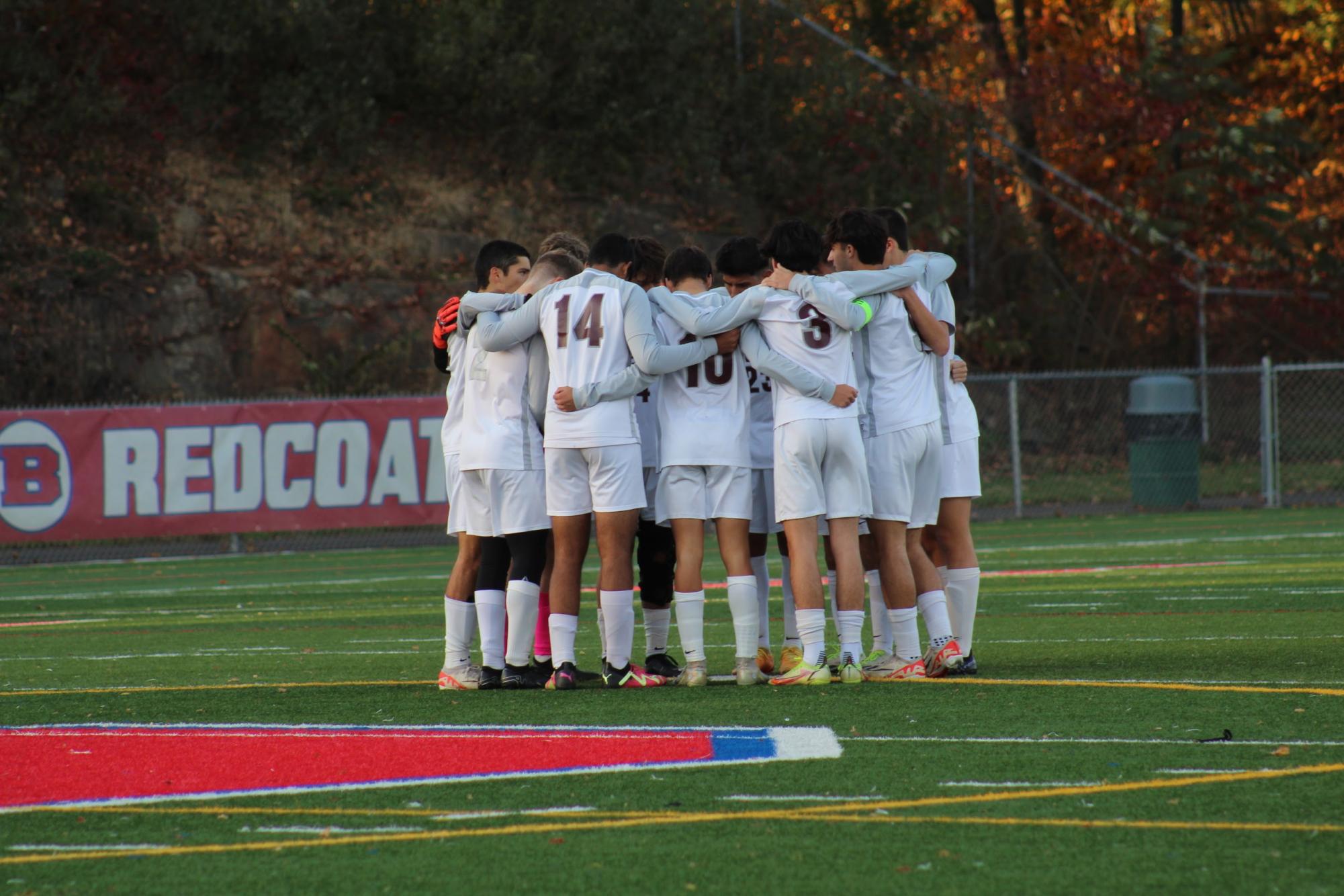 Boys soccer season ends with the team making it to the final in the CCC tournament.  Pictured team huddled during the Glastonbury game.