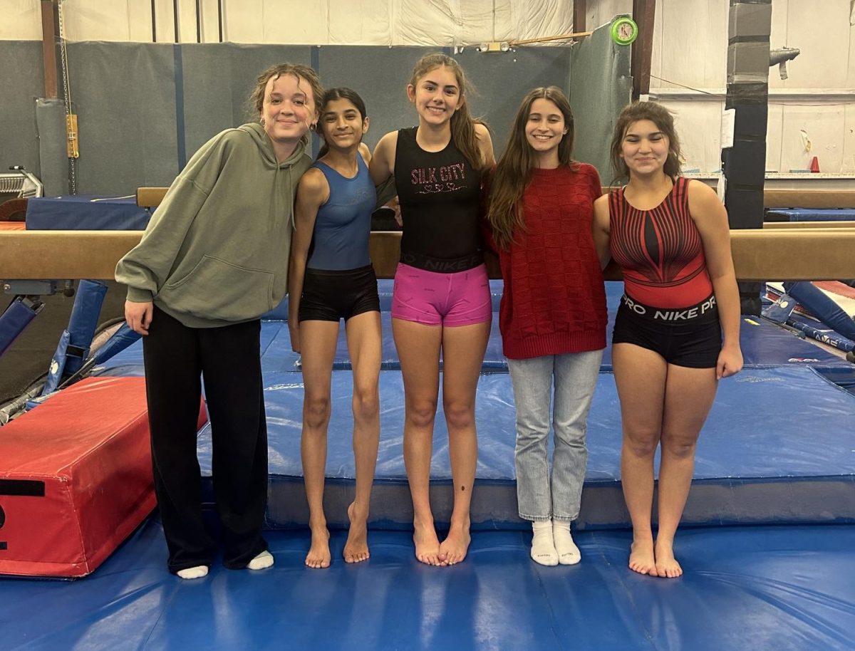 South+Windsor+High+School+gymnastics+team+practice+at+Tri+Town+gym+in+Enfield.+Above+Ava+Natal%2C+Diya+Patel%2C+Madison+Peruccio%2C+Sydney+Main+and+Grace+from+East+Windsor+pose+for+a+photo.