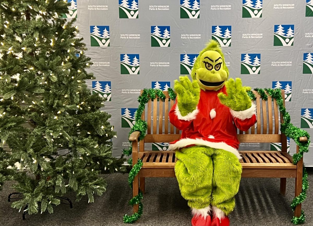 The Grinch awaiting South Windsor families at the Parks and Recreation Grinchmas event
