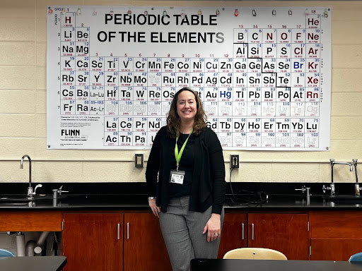 Mrs. Powell, South Windsor High School chemistry teacher standing in her classroom.