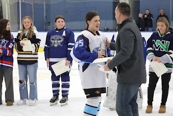 SWHS Junior Lili Ficaro, accepting the CCC ConferencePlayer of the Year Award from CCC Girls’ Ice Hockey Coordinator, Jeff Pinney
