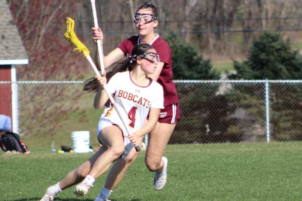 Number+4%2C+sophomore+attack%2C+Jillian+Yelle%2C+runs+towards+goal+during+the+game.+
