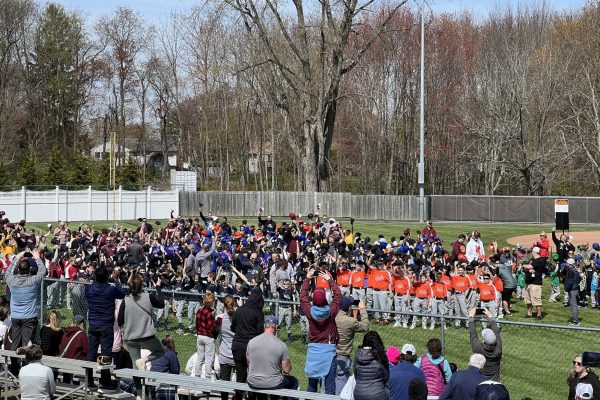 South Windsor Little League teams listening to Opening Day speeches. 