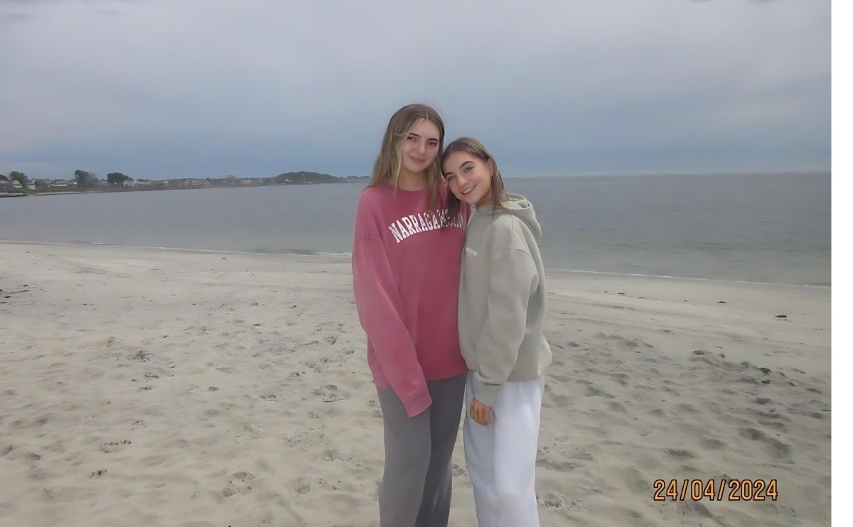Seniors Sarah Stoddard and Isabella Beaulieu pose for a photo on Watch Hills Beach.
