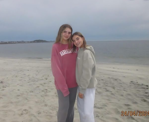 Seniors Sarah Stoddard and Isabella Beaulieu pose for a photo on Watch Hill's Beach.