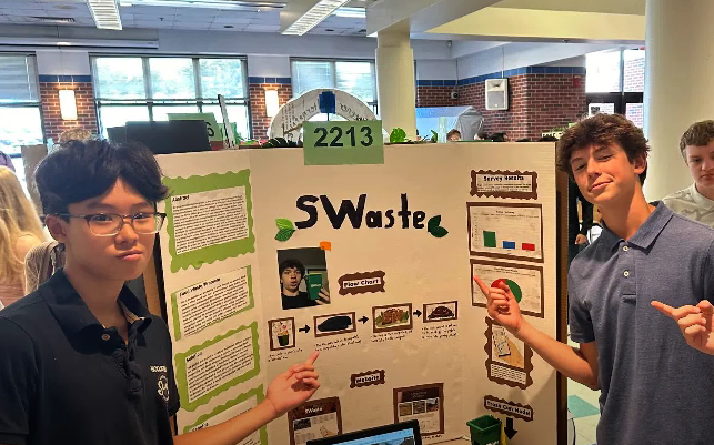 Freshmen students at South Windsor High School display their science fair poster.