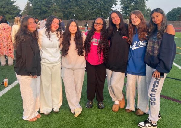 Seven of South Windsor's seniors pose for a photo during the sunrise. 