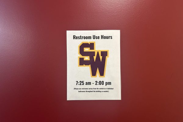 A flyer giving students the operation times for the restrooms.