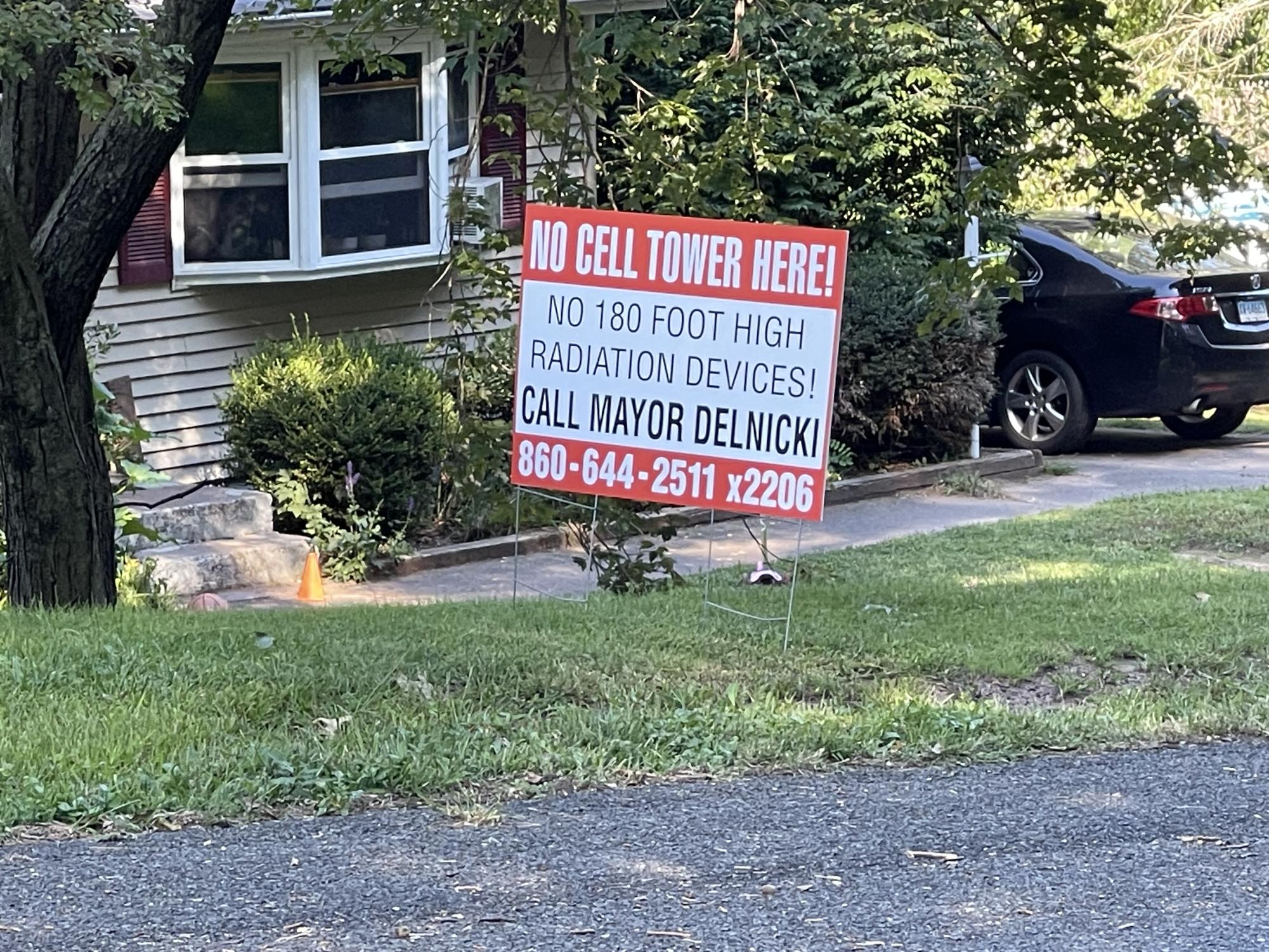 Residents in the Darthill neighborhood of South Windsor put signs on their lawns in order to protest the construction of the planned cell phone tower.