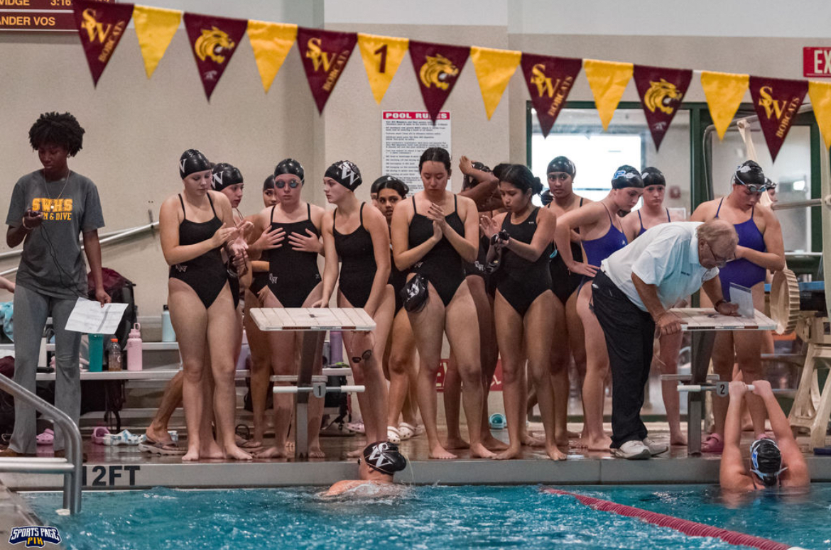 Girls varsity swim team gets ready to dive at Star Hill Pool in Tolland.