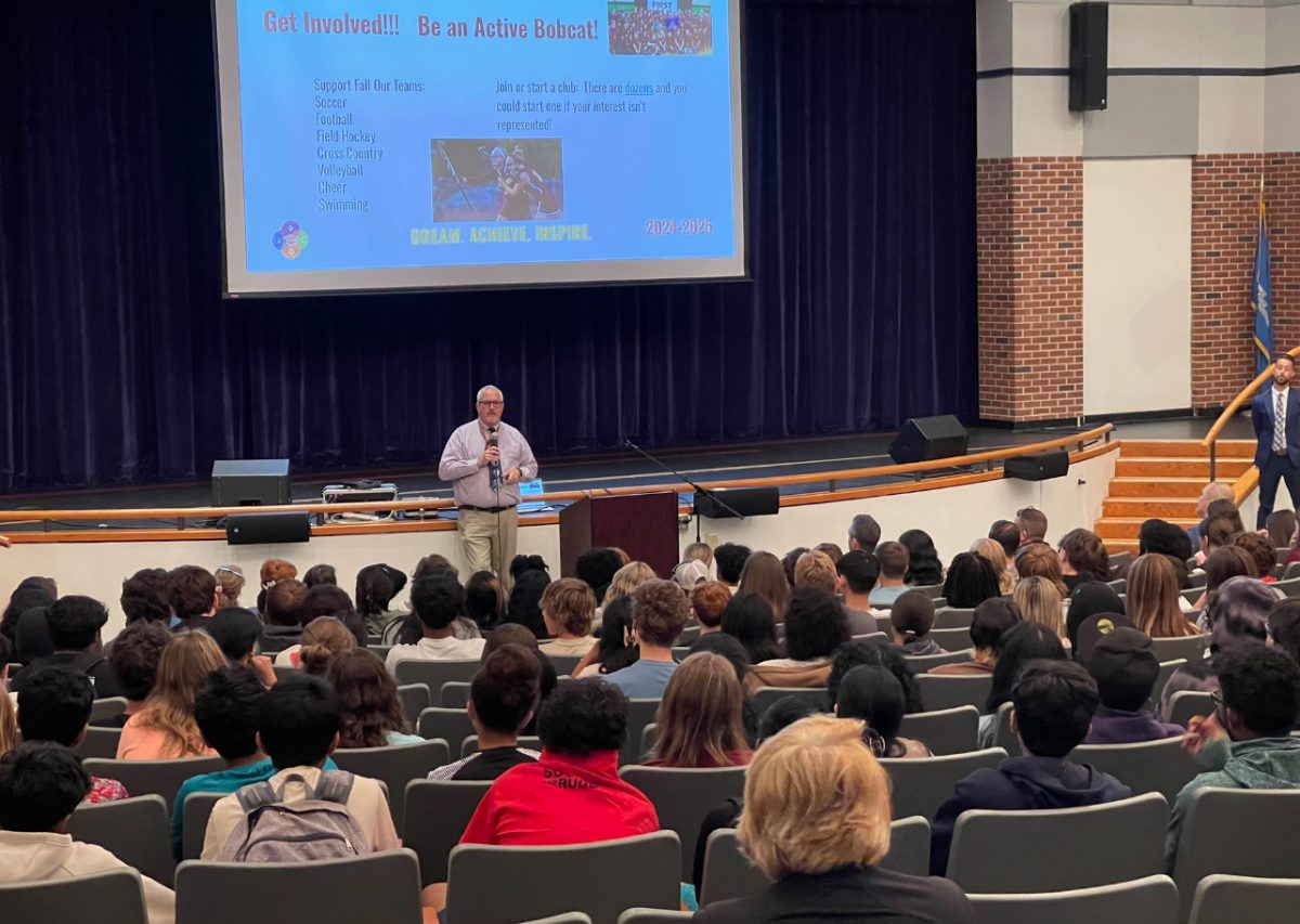 SWHS AP Mr. Zeuschner speaks on the importance of involvement during the Freshman assembly.