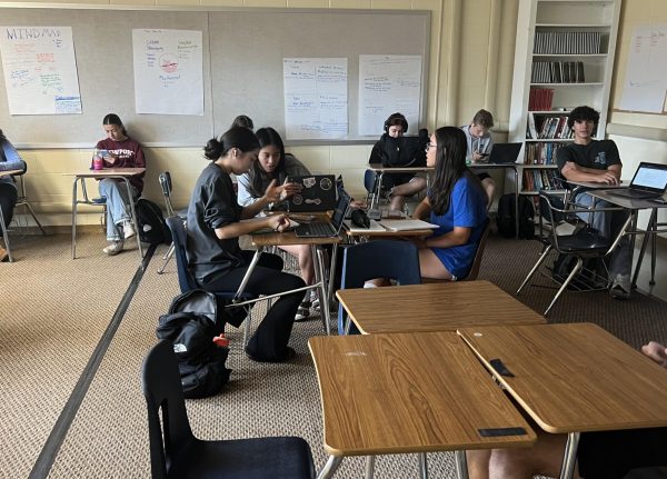 Students together in homeroom enjoying their small break from school.