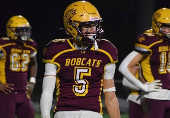 Ethan Burke walks to the line of scrimmage before a game during the 2023 season.