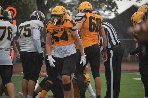 Senior captain Adam Saada makes a huge tackle for loss against the RHAM Raptors on HOCO night.