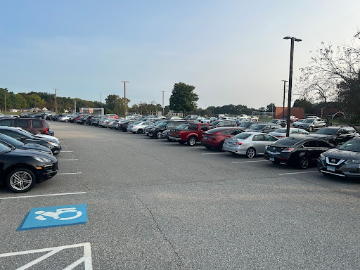 The Gold Lot in front of South Windsor High School in the morning, filled with students' cars. 