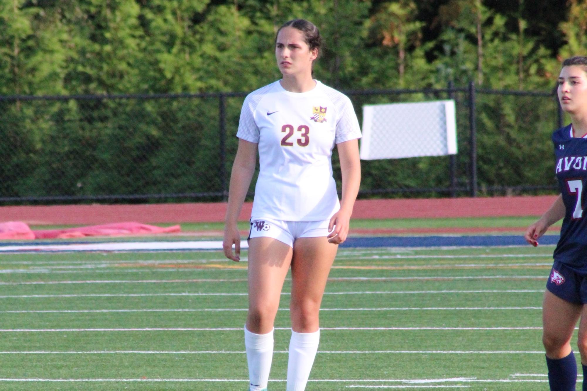 Freshman right center back Allison Marques observing the play from the back line.