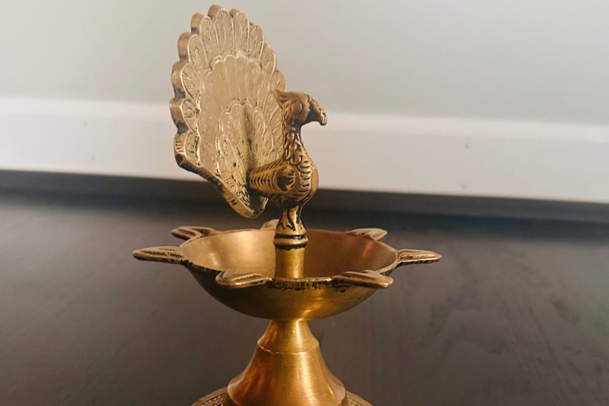 A peacock shaped Diya used to light up the inside of a house during Diwali.