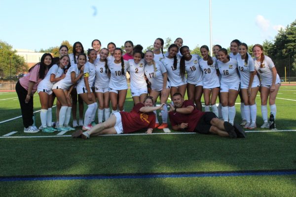 South Windsor High School girls soccer team celebrates a win against Avon.