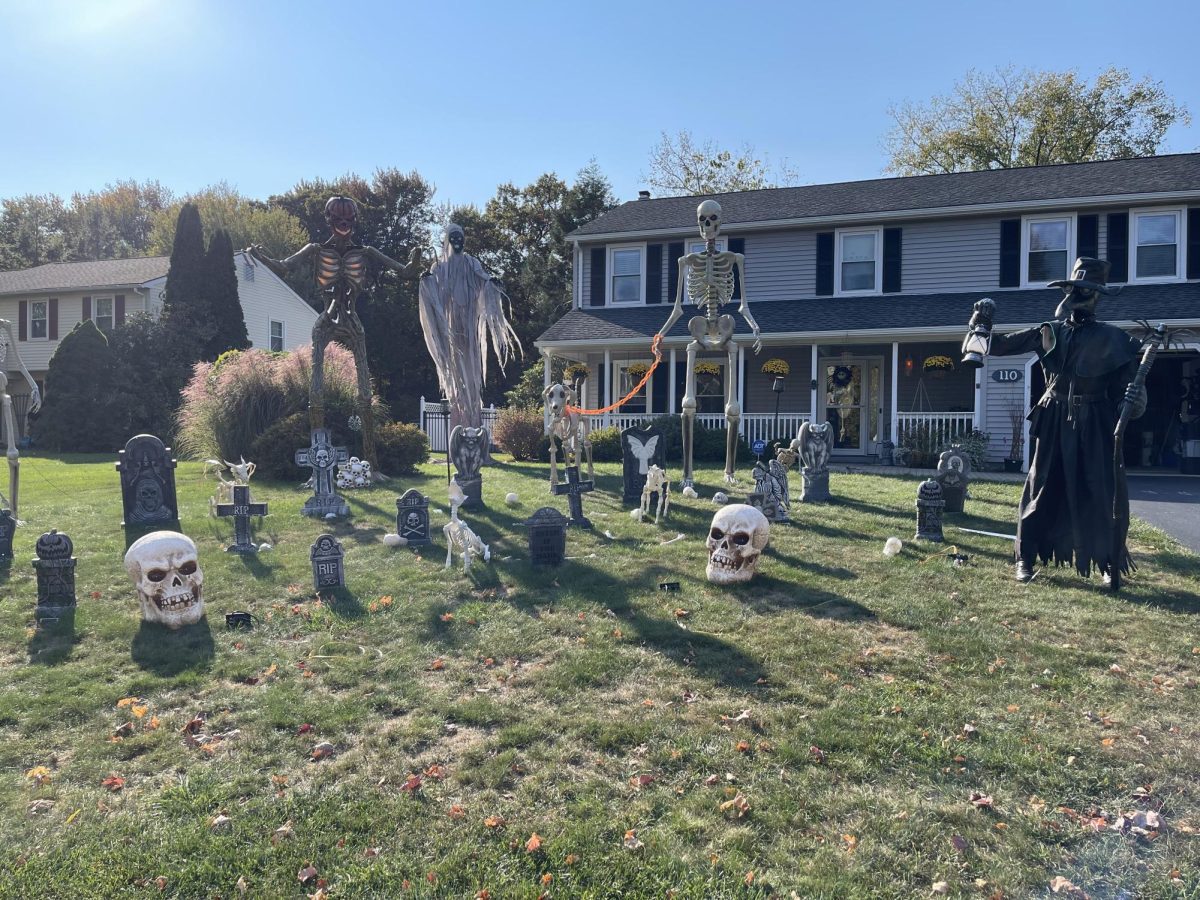 Homeowner Dani Briggs decorated her yard on the tour with huge skeletons and a moving plague doctor. 