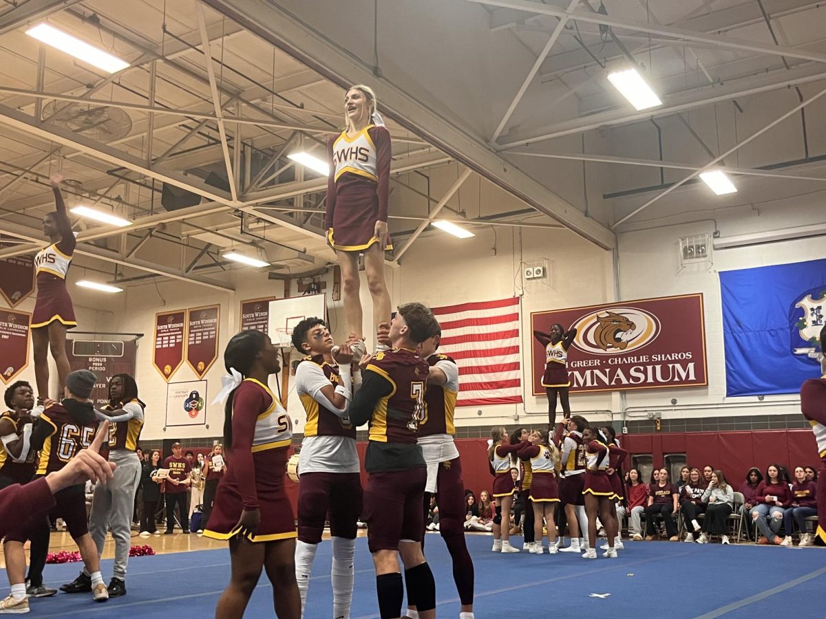 South Windsor High School Cheerleaders perform stunts to hype up the crowd at the annual Pep Rally.