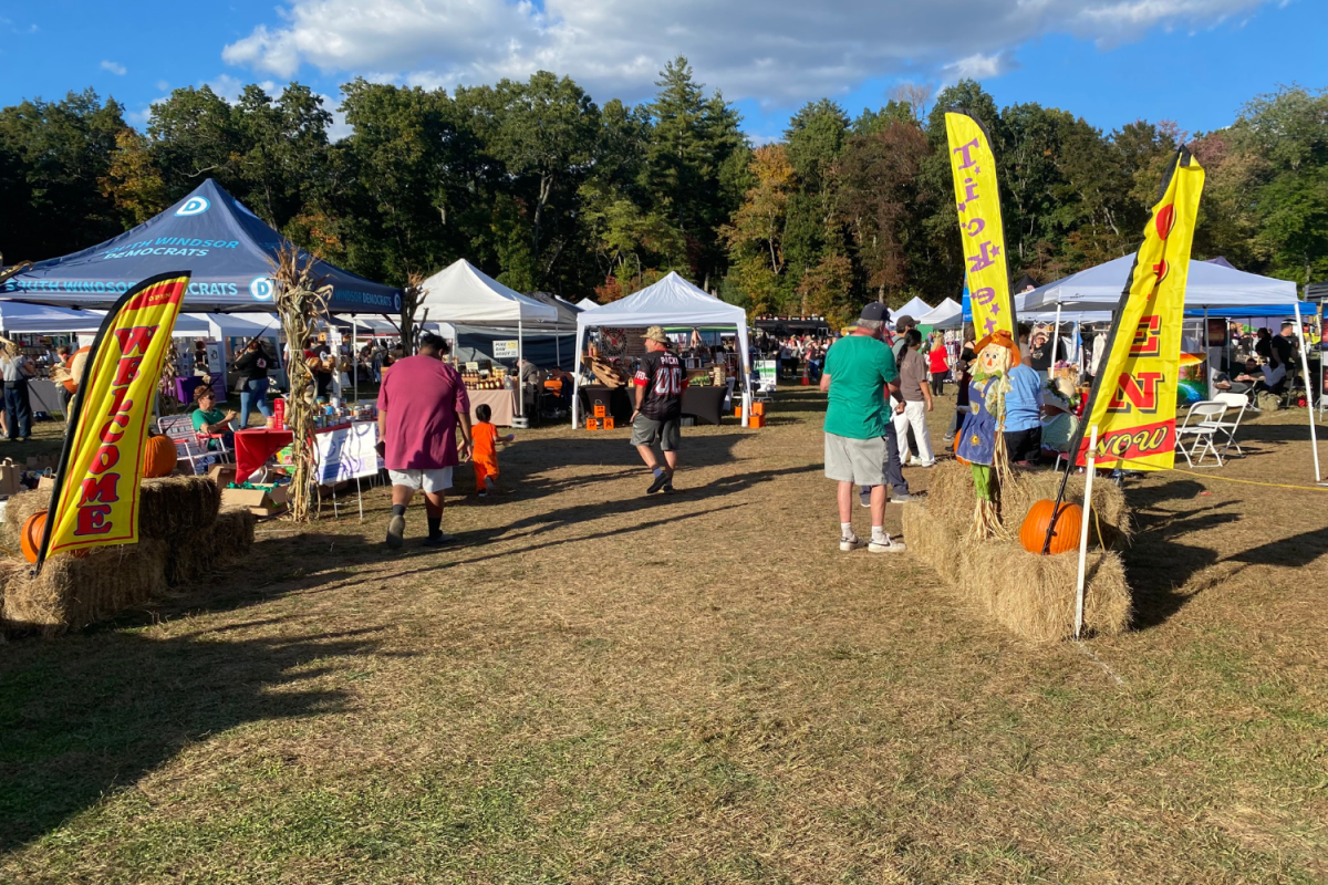 The entrance to the Apple Fest was decorated with scarecrows, pumpkins and flags.