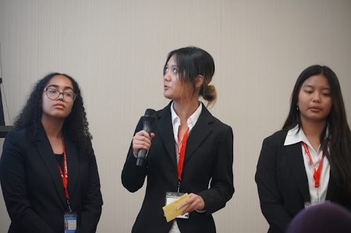 Sophmore Erin Fang at the leadership program over the summer presenting with her team