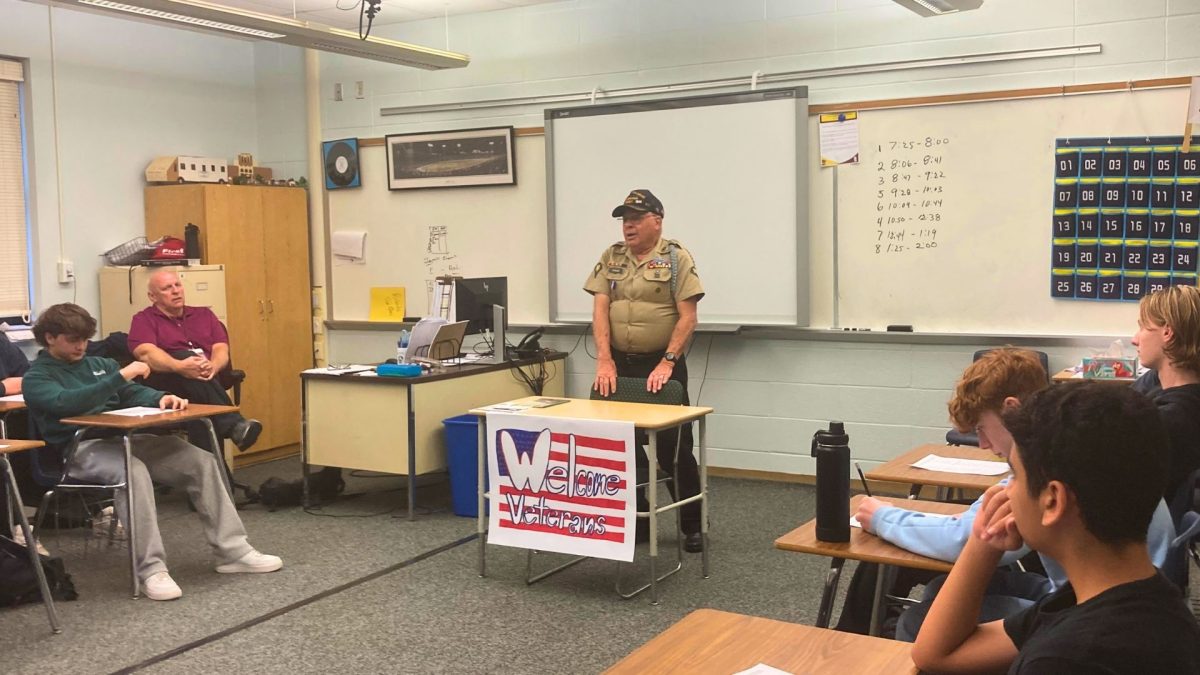 A local veteran speaks to a class of social studies students about his experiences. 