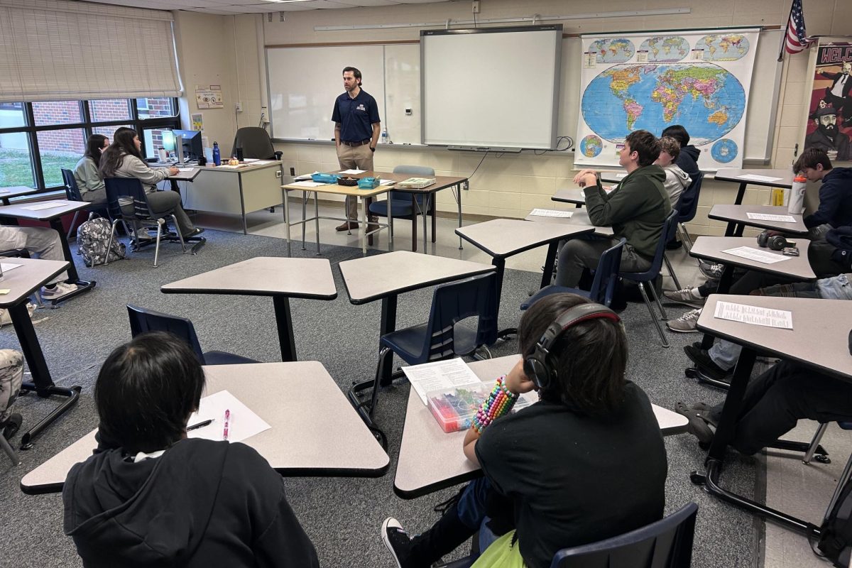 A veteran talking about his experience to a history class full of curious students. 