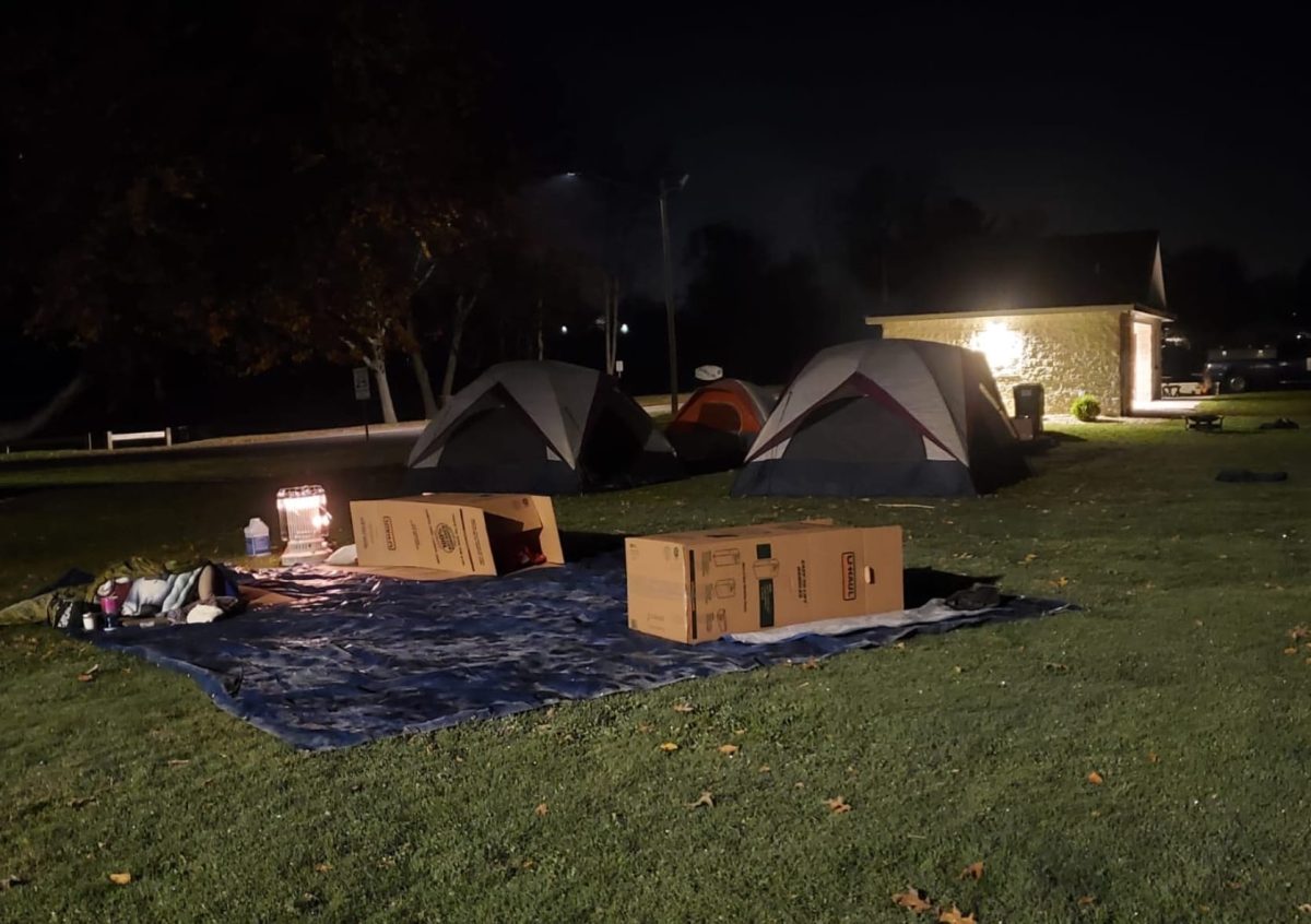 Boxes, tarps, and tents being set up for the sleep-out in the front of Nevers Park in South Windsor. 