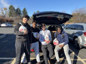 South Windsor High School varsity football captains were ready to hand out turkeys this holiday season. 